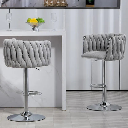 Ensemble de 2 tabourets de bar pivotants avec revêtement en tissu, hauteur comptoir, dossier et repose-pieds, structure en métal.