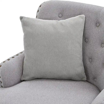 Fauteuil club capitonné avec repose-pieds et coussin