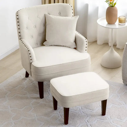 Fauteuil club capitonné avec repose-pieds et coussin