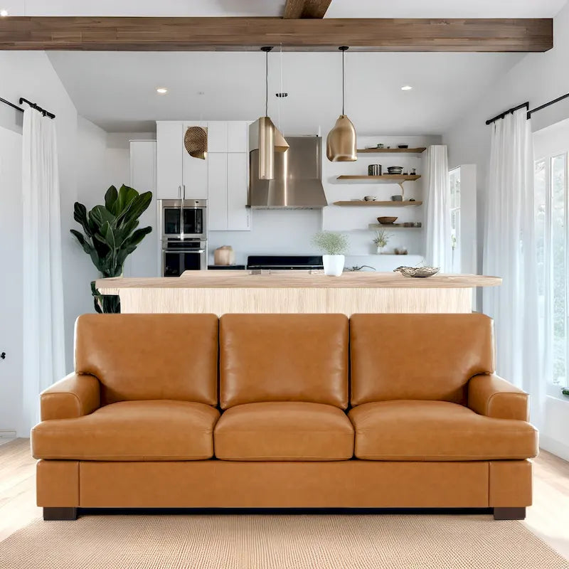 Canapé 3 places haut de gamme en cuir véritable, avec assise profonde et moelleuse et coussins en plumes d'oie pour un confort optimal.