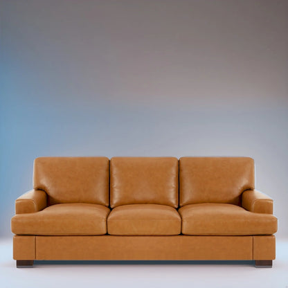 Canapé 3 places haut de gamme en cuir véritable, avec assise profonde et moelleuse et coussins en plumes d'oie pour un confort optimal.