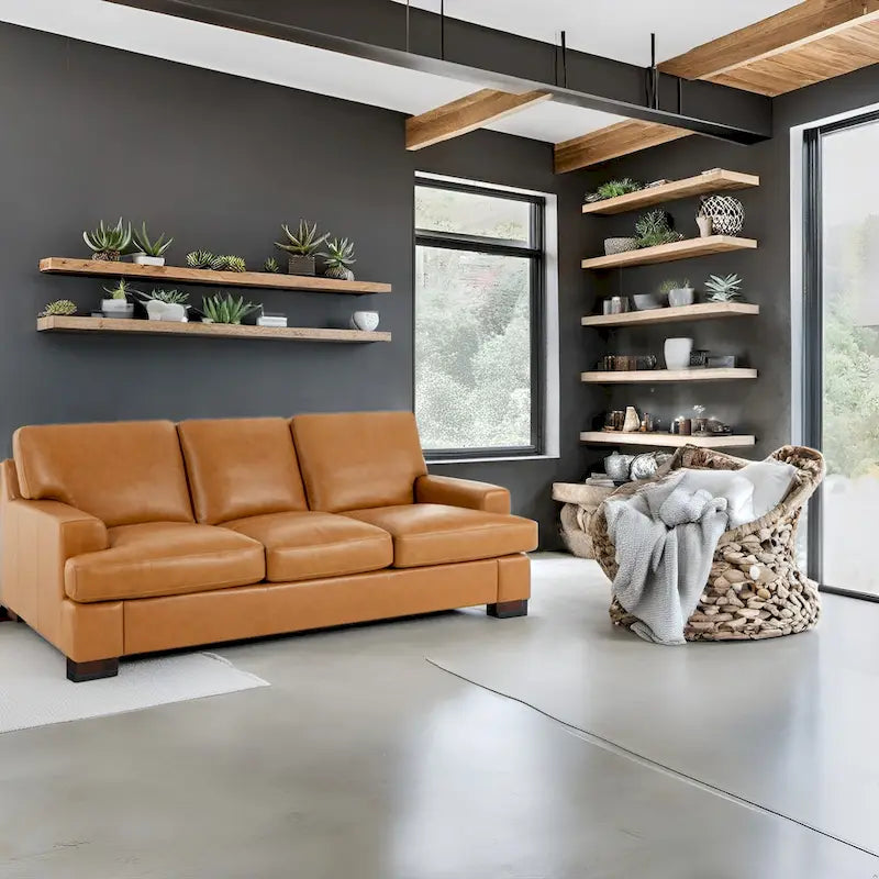 Canapé 3 places haut de gamme en cuir véritable, avec assise profonde et moelleuse et coussins en plumes d'oie pour un confort optimal.