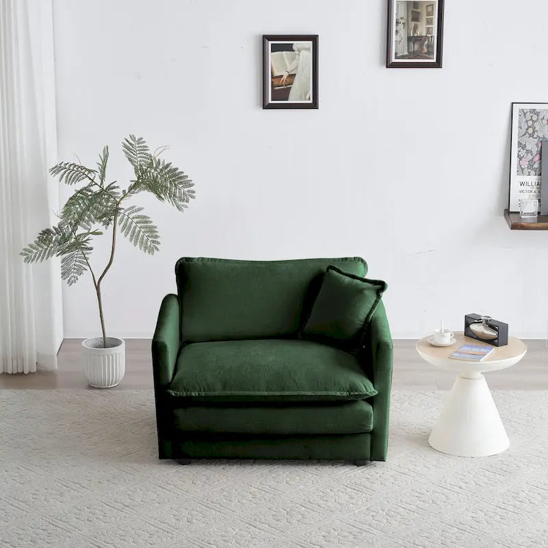 Fauteuil de lecture confortable et profond, une place, en tissu chenille vert, avec 1 coussin décoratif.