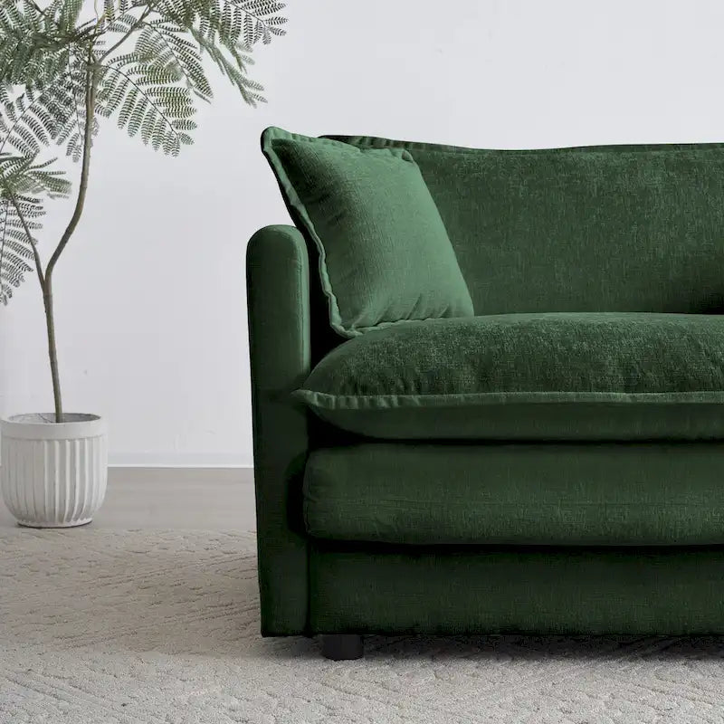 Fauteuil de lecture confortable et profond, une place, en tissu chenille vert, avec 1 coussin décoratif.
