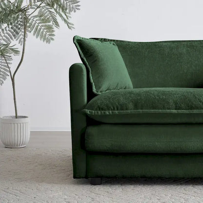Fauteuil de lecture confortable et profond, une place, en tissu chenille vert, avec 1 coussin décoratif.