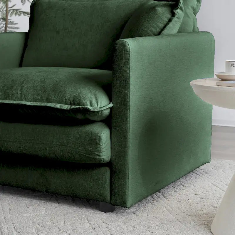 Fauteuil de lecture confortable et profond, une place, en tissu chenille vert, avec 1 coussin décoratif.