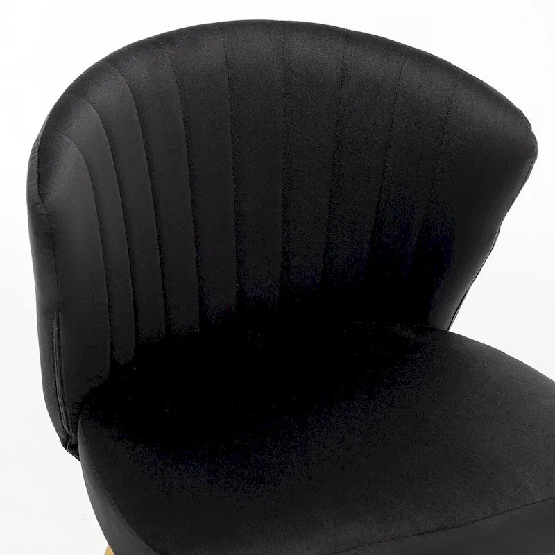Fauteuil d'appoint moderne en velours avec capitonnage à canaux, confortable et tendance, sans accoudoirs.