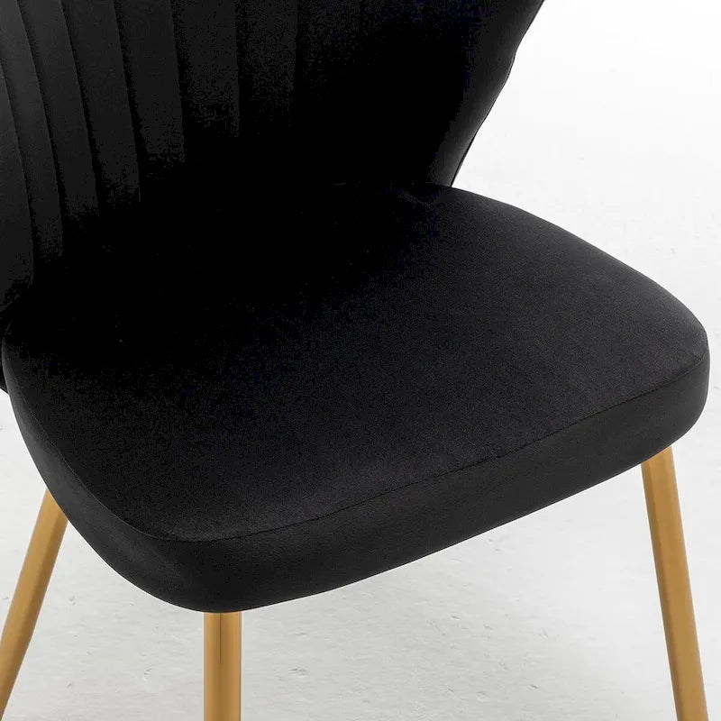 Fauteuil d'appoint moderne en velours avec capitonnage à canaux, confortable et tendance, sans accoudoirs.
