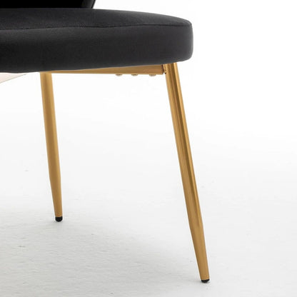 Fauteuil d'appoint moderne en velours avec capitonnage à canaux, confortable et tendance, sans accoudoirs.