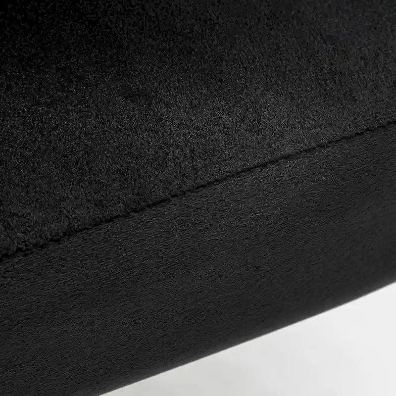 Fauteuil d'appoint moderne en velours avec capitonnage à canaux, confortable et tendance, sans accoudoirs.