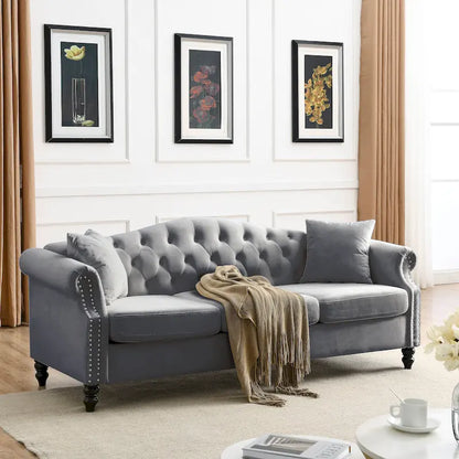 Canapé Chesterfield 3 places capitonné avec accoudoirs arrondis et clous décoratifs
