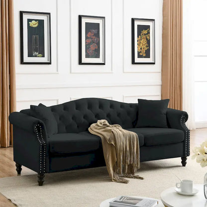 Canapé Chesterfield 3 places capitonné avec accoudoirs arrondis et clous décoratifs