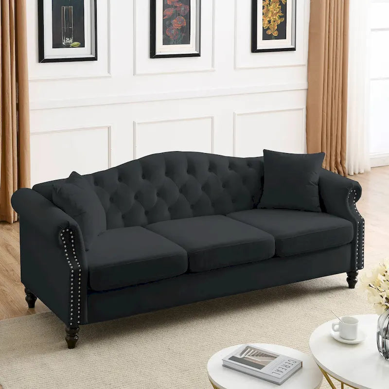 Canapé Chesterfield 3 places capitonné avec accoudoirs arrondis et clous décoratifs