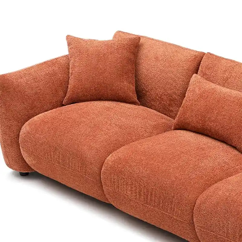 Canapé d'angle blanc confortable et moelleux, garni de duvet d'agneau, avec pouf