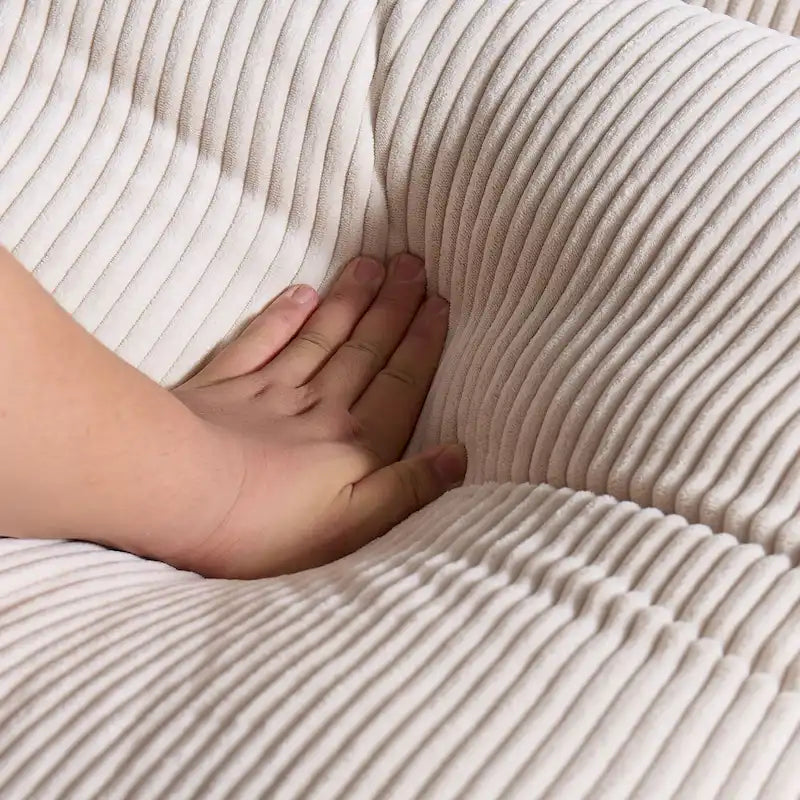 Canapé d'angle profond en velours côtelé avec pouf et coussins