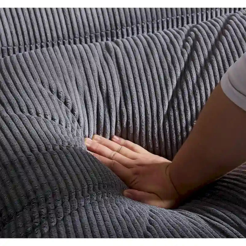 Canapé d'angle profond en velours côtelé avec pouf et coussins