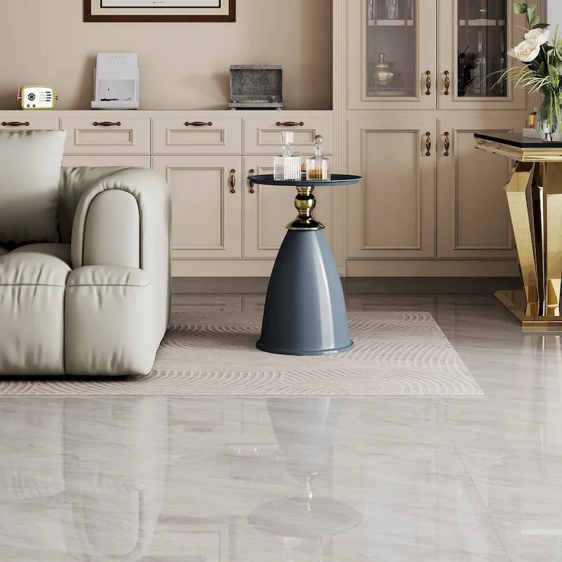 Table d'appoint ronde minimaliste en fer forgé au design luxueux, idéale pour les petits espaces.